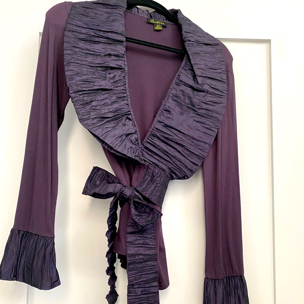 Carrie’s Size S. Shirt with long sleeves that wraps around belted.